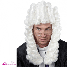 a man is wearing a white wig and glasses with the words a22 fancy dress behind him