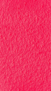 a close up of a bright pink background with a texture