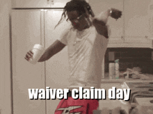 a man dancing in a kitchen with the words waiver claim day written on the bottom