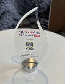 a trophy that says ' crypto expo ' on it