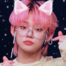 a close up of a person with pink hair and cat ears wearing glasses .