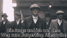 a group of men are walking in a line with the words die jungs and ich auf dem weg zum burgerking friesoythe written below