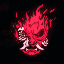 a red and white drawing of a samurai mask with flames coming out of it