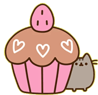 a cat is standing next to a cupcake with hearts on it .