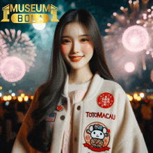 a woman wearing a totomacau jacket is smiling in front of fireworks