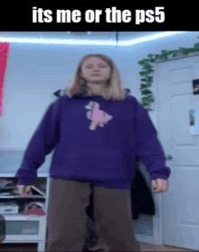 a girl in a purple hoodie is standing in front of a door with the words " its me or the ps5 "