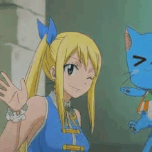 a girl in a blue dress is standing next to a blue cat with a happy face .