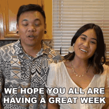 a man and a woman are standing next to each other with the words " we hope you all are having a great week "