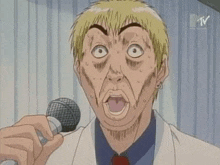 a man is singing into a microphone with his mouth open .