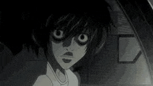 a black and white photo of a cartoon character with big eyes .