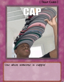 a picture of a man holding up a stack of hats with the caption cap