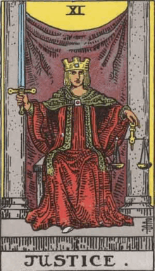 the justice tarot card is a woman holding a sword and scales .