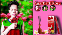 a man holding a rose next to a box of agarbatti rose