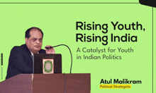 a man stands at a podium with the words rising youth rising india