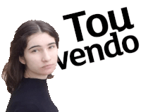 a woman is standing in front of a sign that says tou vendo on it .