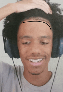 a man wearing headphones has a line drawn on his head