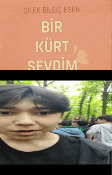 a young boy stands in front of a book cover that says bir kurt sevdim