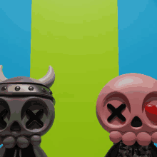 a skull with horns is next to a pink skull with a red nose