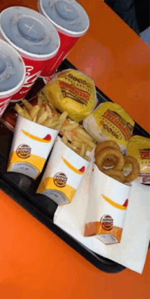 a tray of burger king hamburgers and french fries