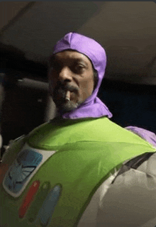 snoop dogg is dressed as buzz lightyear from toy story and smoking a cigarette .