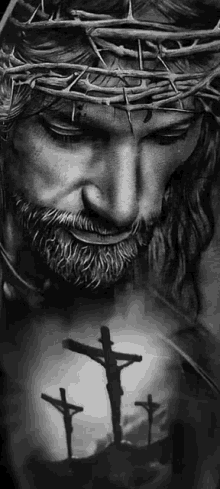 a black and white photo of jesus with a crown of thorns and three crosses in the background .