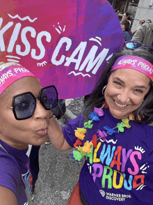 two women wearing headbands that say always proud