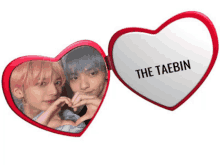 a heart shaped mirror with the taebin on it