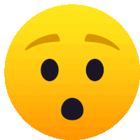 a yellow smiley face with black eyes and a surprised expression