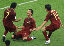 a soccer player with the number 17 on his jersey is kneeling down