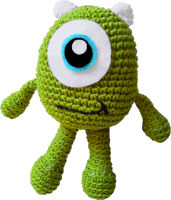 a green crocheted monster with a blue eye and white ears