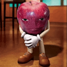 a cartoon apple with arms and legs is sitting on the floor with its hands folded .