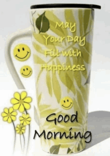 a mug with smiley faces and the words " may your day fill with happiness "