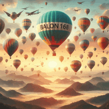 many hot air balloons are flying in the sky and one of them has balon 168 on it