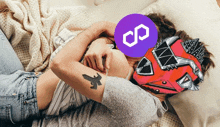 a man and a woman are laying on a bed with a purple infinity symbol on their faces