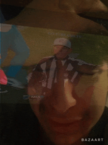 a close up of a person 's face with a picture of a referee behind it