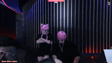 a girl with pink hair is standing next to a man in a video game