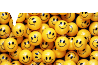 a pile of yellow smiley faces on a white background stock photo