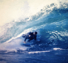 a surfer is riding a wave in the ocean