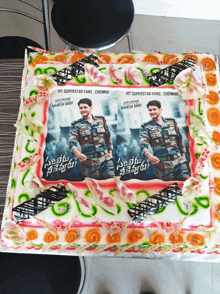 a cake with a picture of a man and the words vit superstar fans on it