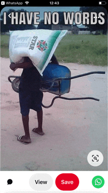 a phone screen shows a man carrying a wheelbarrow and a bag that says star on it