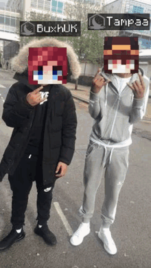 a man and a woman are standing next to each other on a street . the man has a minecraft avatar on his face .