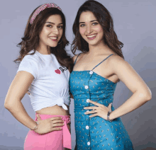 two women posing for a picture with one wearing a white shirt that says i love you