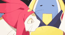 a cat wearing a red scarf is laying next to a yellow penguin