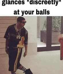 a man is standing in a room with the words glances discreetly at your balls on the bottom