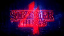 the logo for the fourth season of stranger things is glowing in the dark .