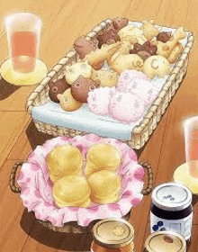 a basket filled with a variety of breads and pastries is sitting on a wooden table .