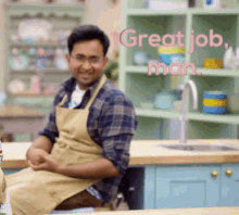 a man in an apron sits in front of a kitchen counter with the words great job man above him