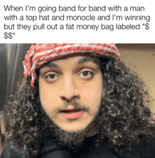 a man with curly hair and a beard is wearing a red and white bandana