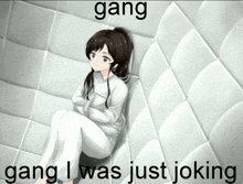 a girl in a straight jacket is sitting in a room with the words gang gang i was just joking below her