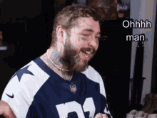 a man with a beard wearing a cowboys jersey says ohhhh man